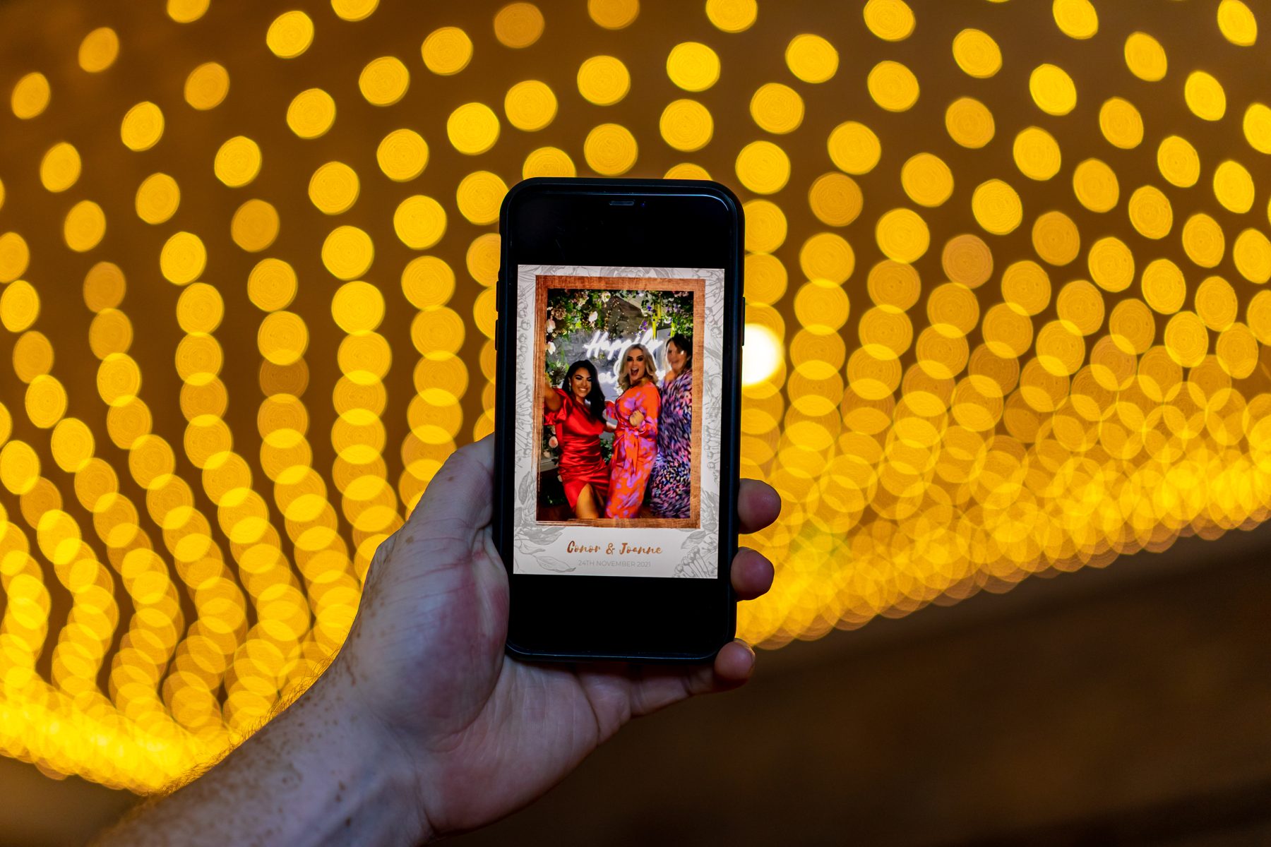 Guests posing at a MIGHTY photo booth